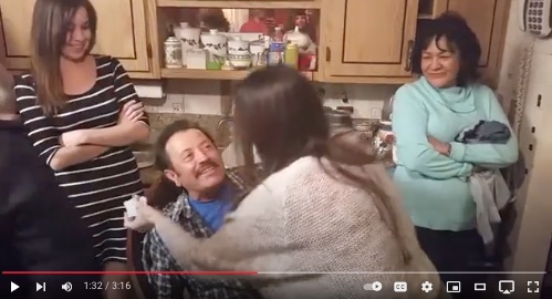 image of daughters hugging dad at his 70th mariachi birthday surprise
